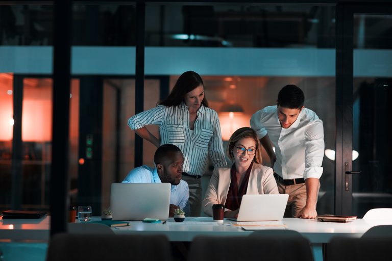 Office people sitting around a table